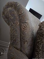 Close-up of arm showing floral fabric and heavy fraying