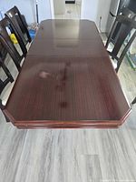 Top view of dining table showing finish and surface stain