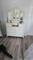 Full view dresser with tri-fold mirror attached