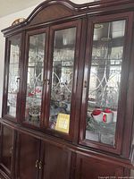 Full view of china cabinet showing glass hutch and wooden base