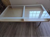 Top view showing glass surface and divided storage areas