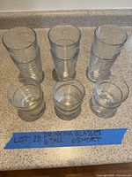 All 12 ribbed clear glasses grouped by height