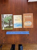 All three Oakville history books on tabletop