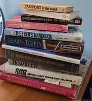 Stack of aviation books showing spines for title verification