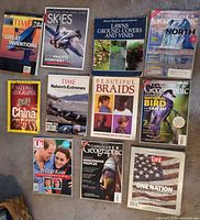 All eleven magazines and books laid out showing covers