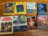 All eight paperback books laid out, covers visible