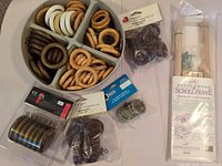 Overall lot showing tray with loose rings and packaged hardware
