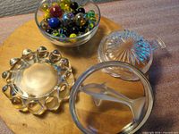 All four glass pieces and marbles on display