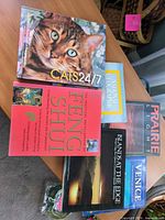 All six books arranged on tabletop