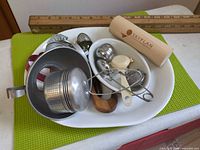Overview of platter with assorted infusers, funnel, cookie cutter, Skyplan tube