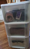 Full view of 3-drawer plastic organizer with yarn visible inside drawers