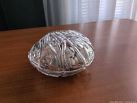 Closed clear glass dish side view on tabletop