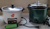 Both cookers side-by-side showing overall appearance and attached cords