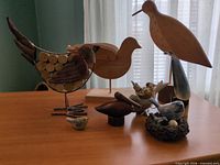 Group view of seven bird figurines