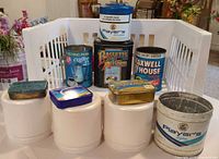 Group shot showing all eight vintage tins