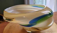 Side profile showing free-form shape and color ribbons