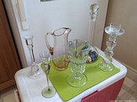 Group view of all glassware pieces, cat bells and marbles