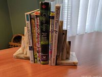 Both onyx bookends holding books on tabletop