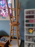 Stool upside down showing legs and construction