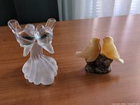 Both figurines side by side on table