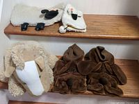 Slippers, large plush dog, sheep holder, book cover on steps