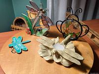 All four decorative pieces on tabletop showing variety