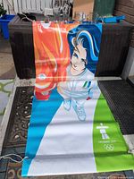 Banner unrolled showing full graphic and glassware in background
