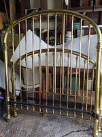 Front view of brass headboard and footboard together