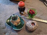 All six items arranged with ruler for scale
