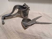 Wear-Ever lever citrus press and Ebaloy hand press side by side
