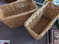 Two empty wicker baskets side by side
