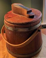 Overall view of wooden firkin bucket with lid and handle