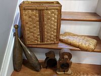 Group shot showing basket, lid, two bowling pins and two coin banks