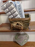 Basket holding ice cube trays with plaque in foreground