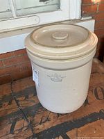 Full view of crock with lid showing size and color