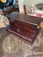 Front view of wooden desk organizer showing closed lid and drawer