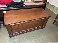 Front view of Huppe cedar-lined blanket box closed