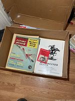Box showing Flying Review and Winchester Collector publications