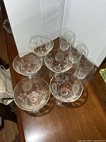 All eight etched glass pieces grouped on table