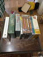 Overview of thirteen DVD box sets on table