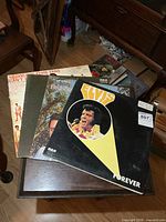 Front covers of four stacked Elvis Presley LPs