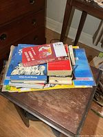 Stack showing books, cereal boxes, and VHS