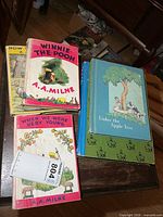 Stack of four vintage children’s books on table