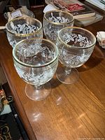 Four glass goblets grouped on tabletop