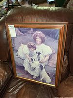 Front view of framed signed print on leather chair