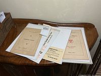Group of plastic-sleeved documents on table