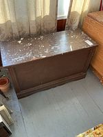 Top and front view of painted blanket box showing overall design and paint splatter