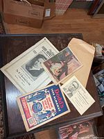Group shot showing all five pieces of ephemera