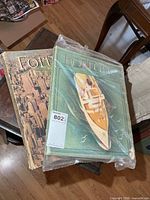 Two large Fortune magazines stacked