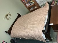 Full view of assembled queen bed with duvet